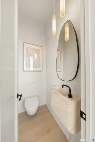 a bathroom with a sink mirror and vanity