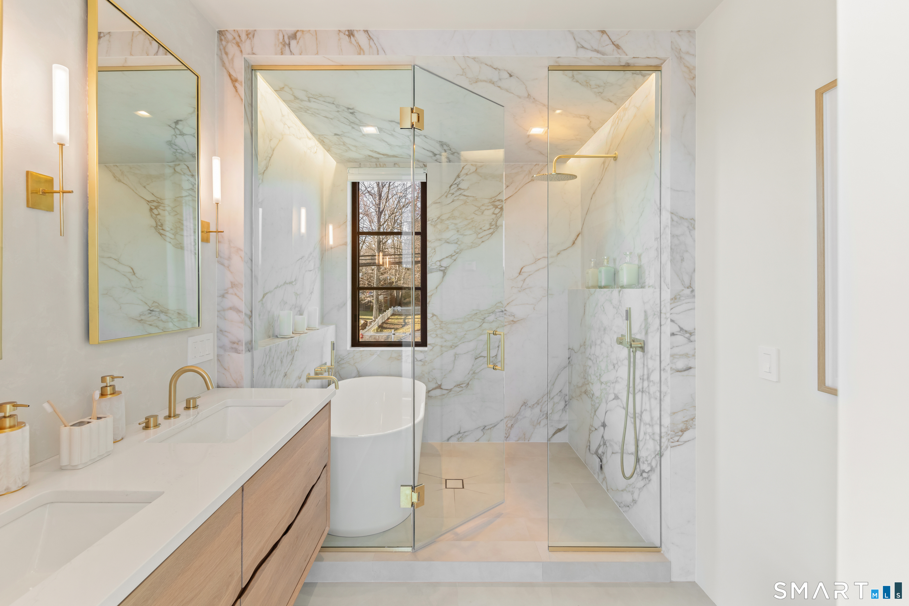 79 Riverside Avenue Westport, CT 06880 - Photo 16 of 40 a bathroom with a sink a toilet and shower