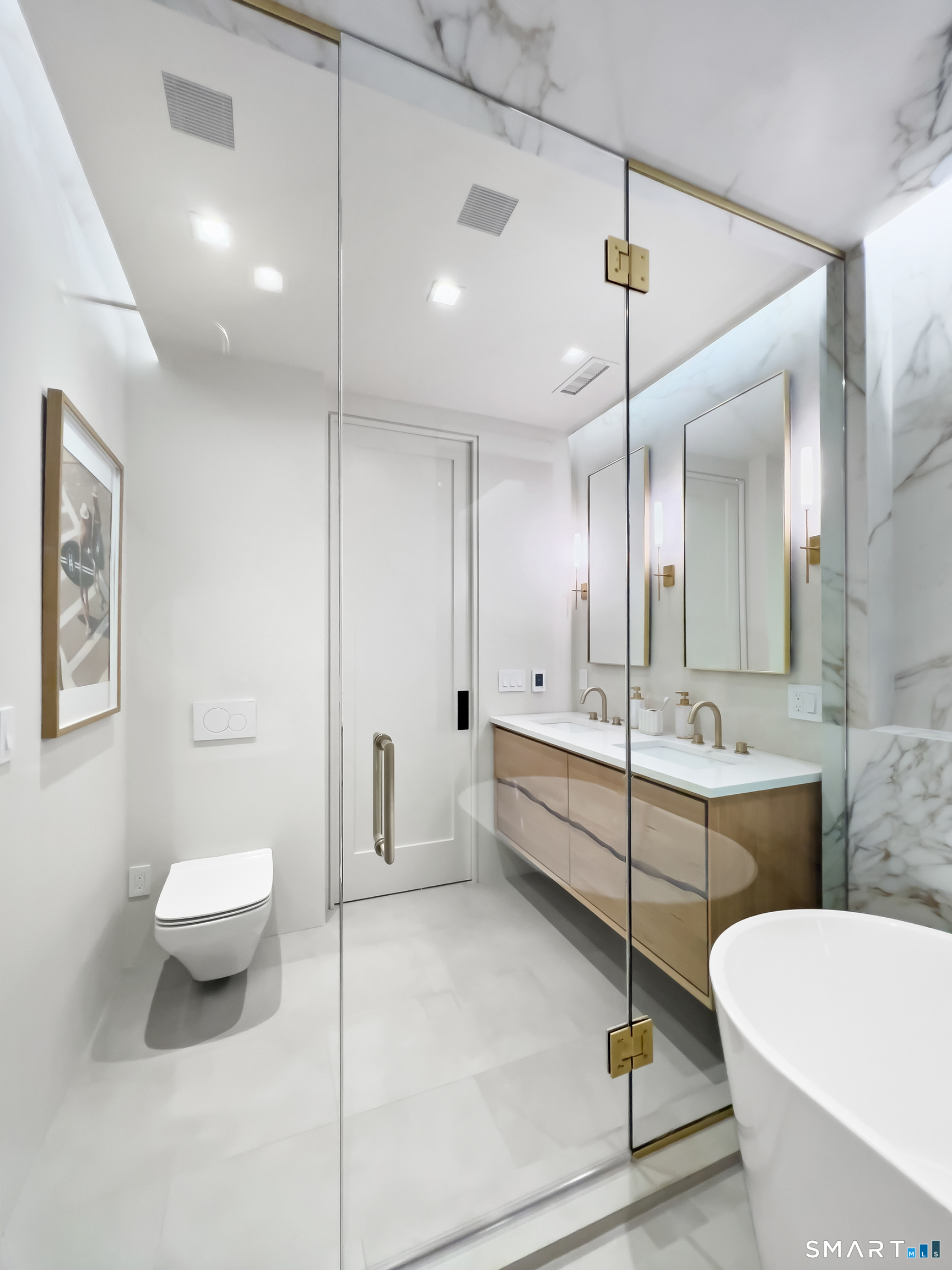 79 Riverside Avenue Westport, CT 06880 - Photo 17 of 40 a large bathroom with a large tub and shower