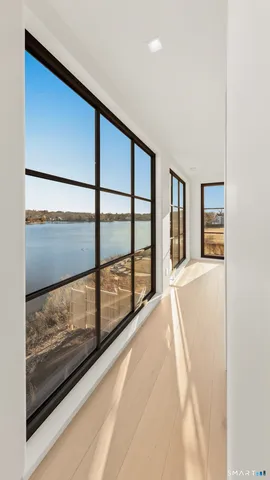 a bedroom with a large bed and a large window
