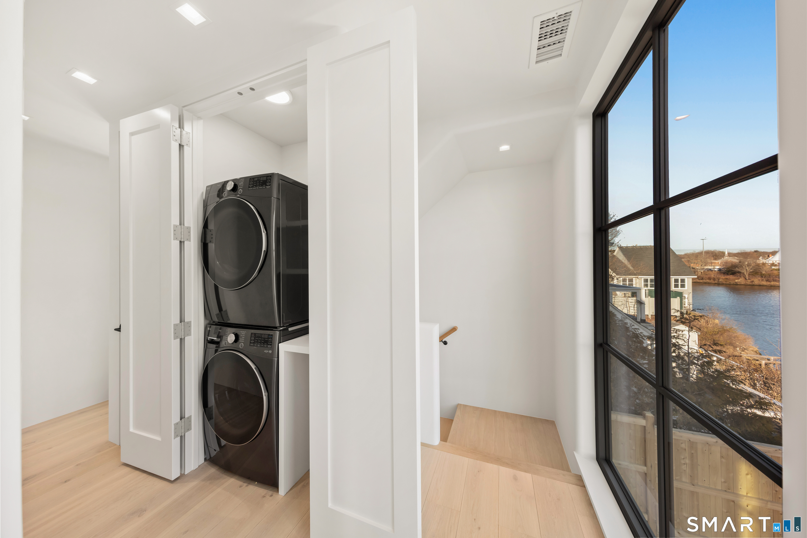 79 Riverside Avenue Westport, CT 06880 - Photo 20 of 40 a view of a hallway with washer and dryer