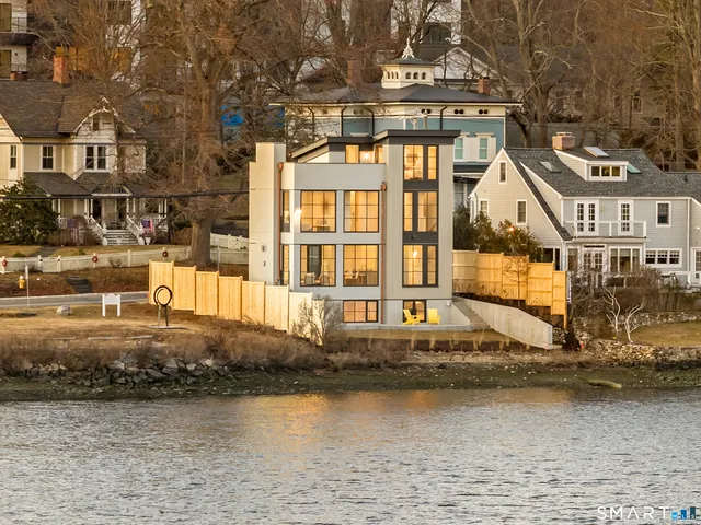 a front view of a building with lake view