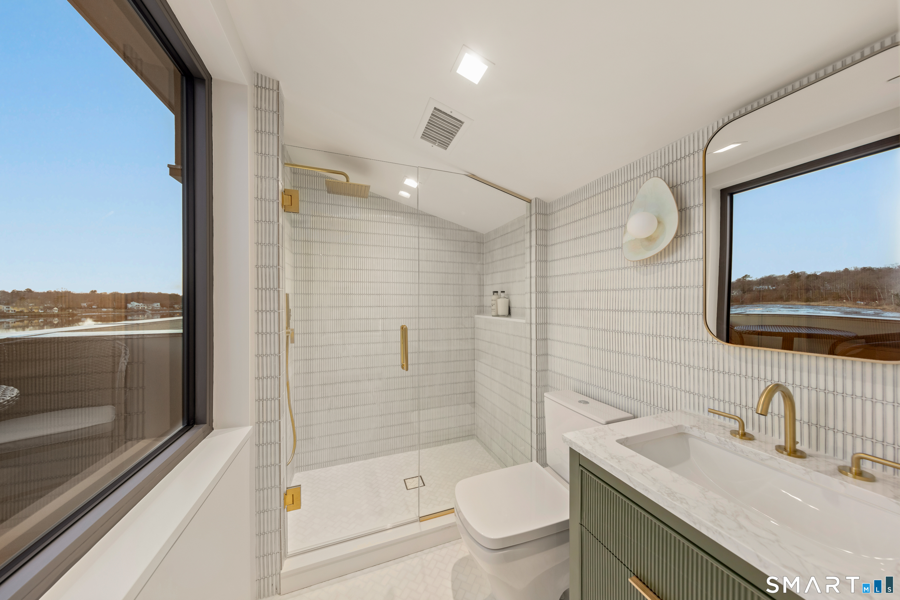 79 Riverside Avenue Westport, CT 06880 - Photo 36 of 40 a bathroom with a sink a toilet and shower