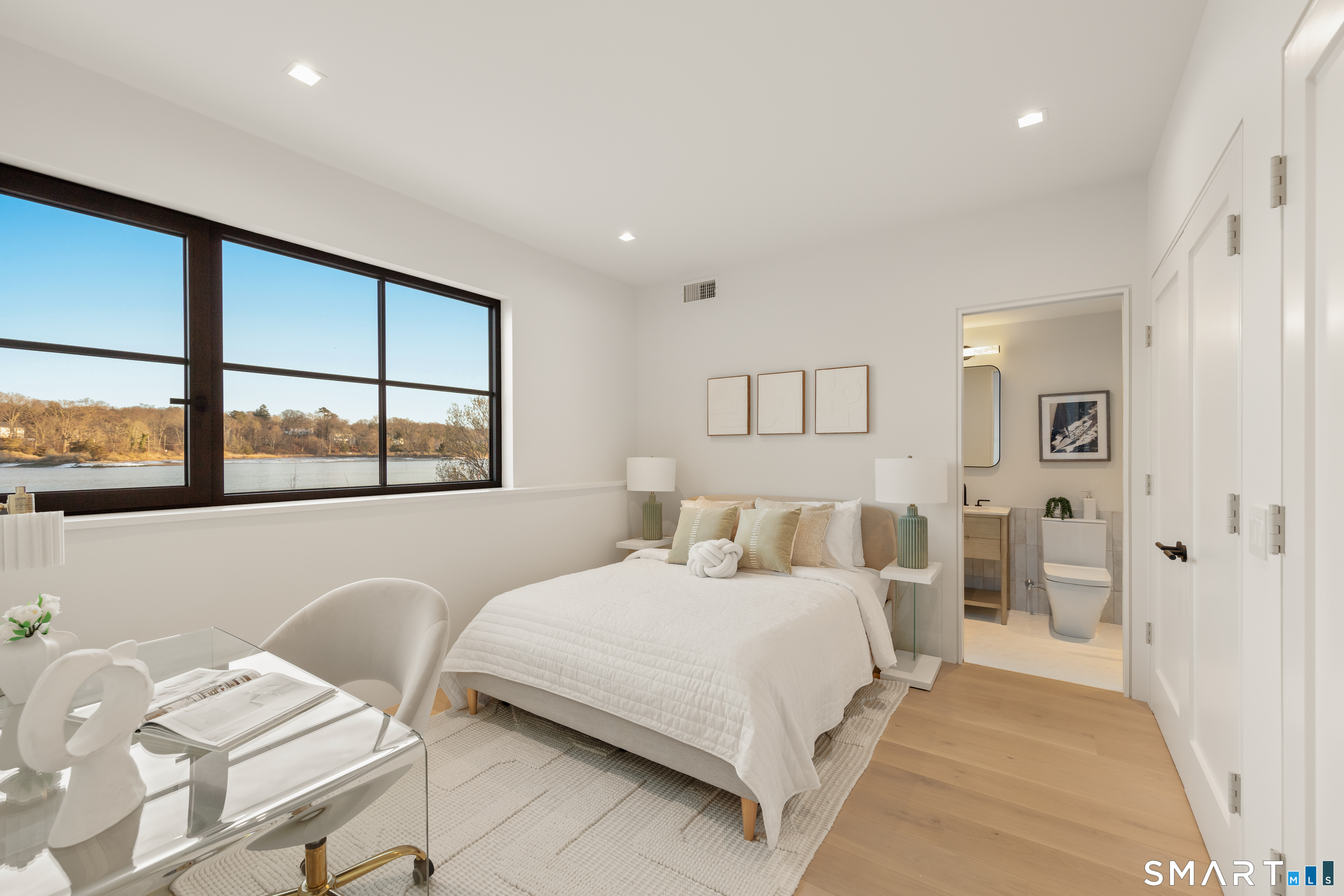 79 Riverside Avenue Westport, CT 06880 - Photo 39 of 40 a bedroom with a large bed and a window