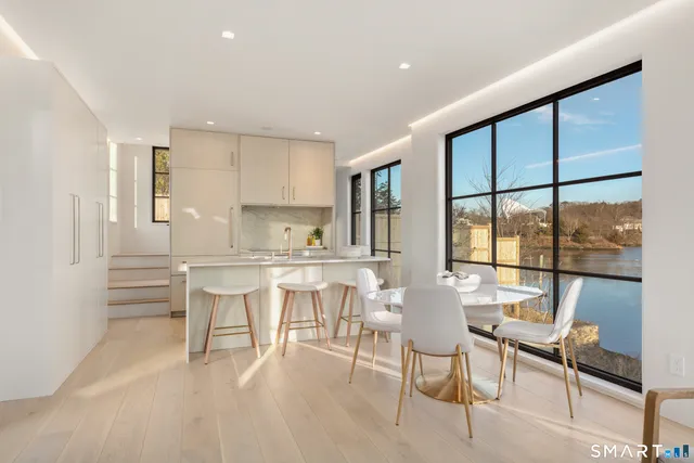 a view of a dining room with furniture window and outside view