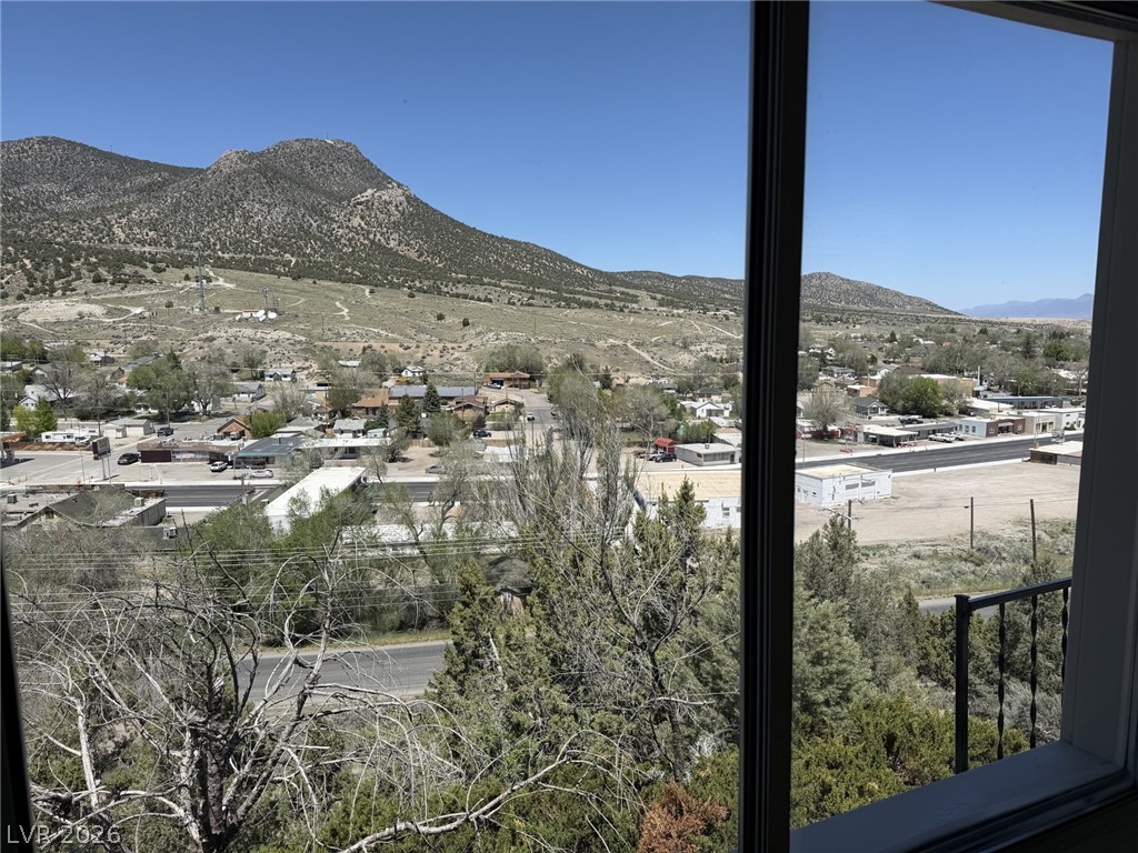 1 Carson Court Ely, NV 89301 - Photo 5 of 20 Framed by expansive windows, enjoy panoramic mountain vistas and charming town views.