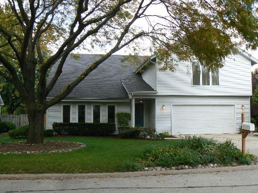 2406 Sun Valley Road Lisle, IL 60532 - Photo 1 of 1 a front view of a house with a garden