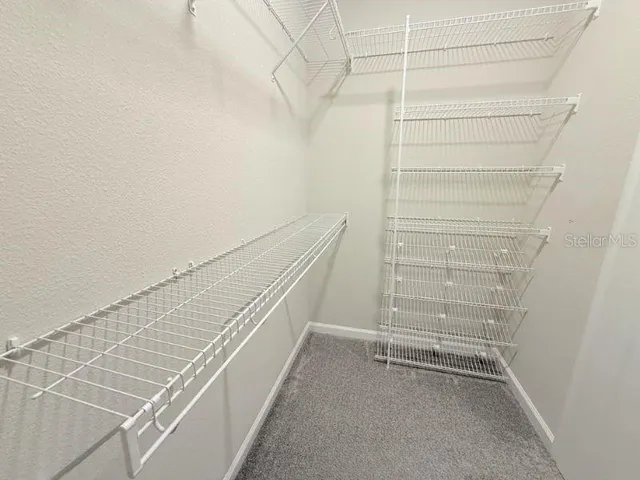 a bathroom with a sink toilet and a mirror