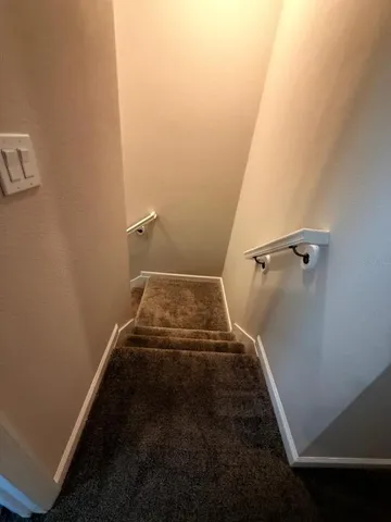 a bathroom with double vanity sink and a mirror