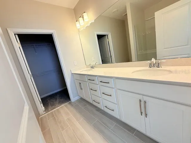 a bathroom with a glass door shower