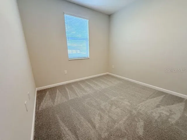 a bathroom with a granite countertop shower