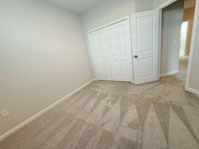 a view of a hallway with a white walls