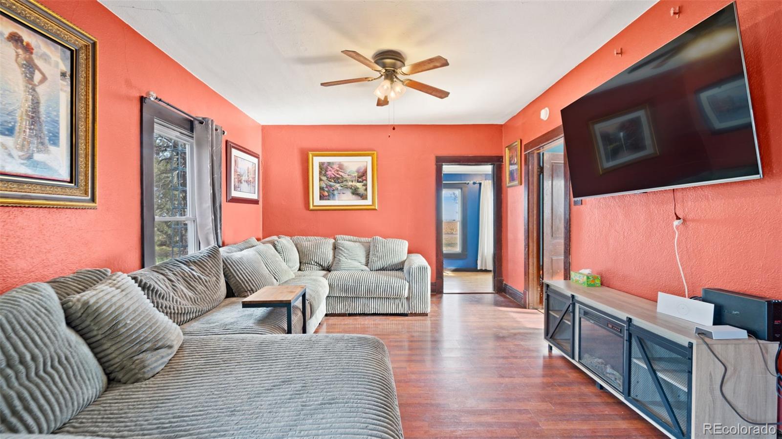 1935 County Road 75 Fleming, CO 80728 - Photo 11 of 50 a living room with furniture ceiling fan and a rug