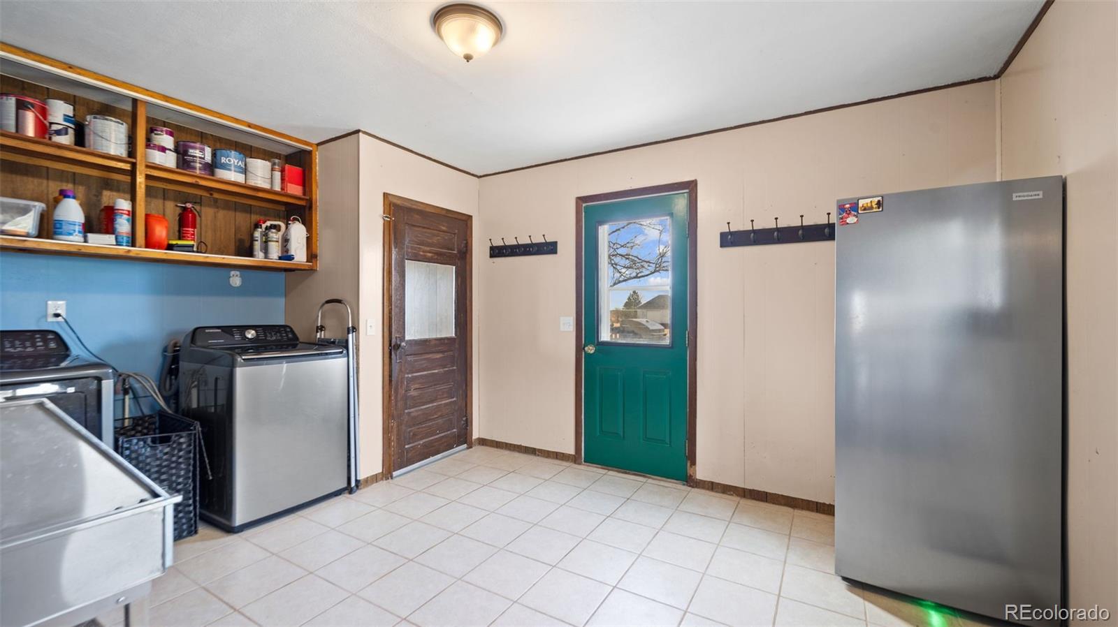 1935 County Road 75 Fleming, CO 80728 - Photo 17 of 50 a view of a kitchen with fridge and rack