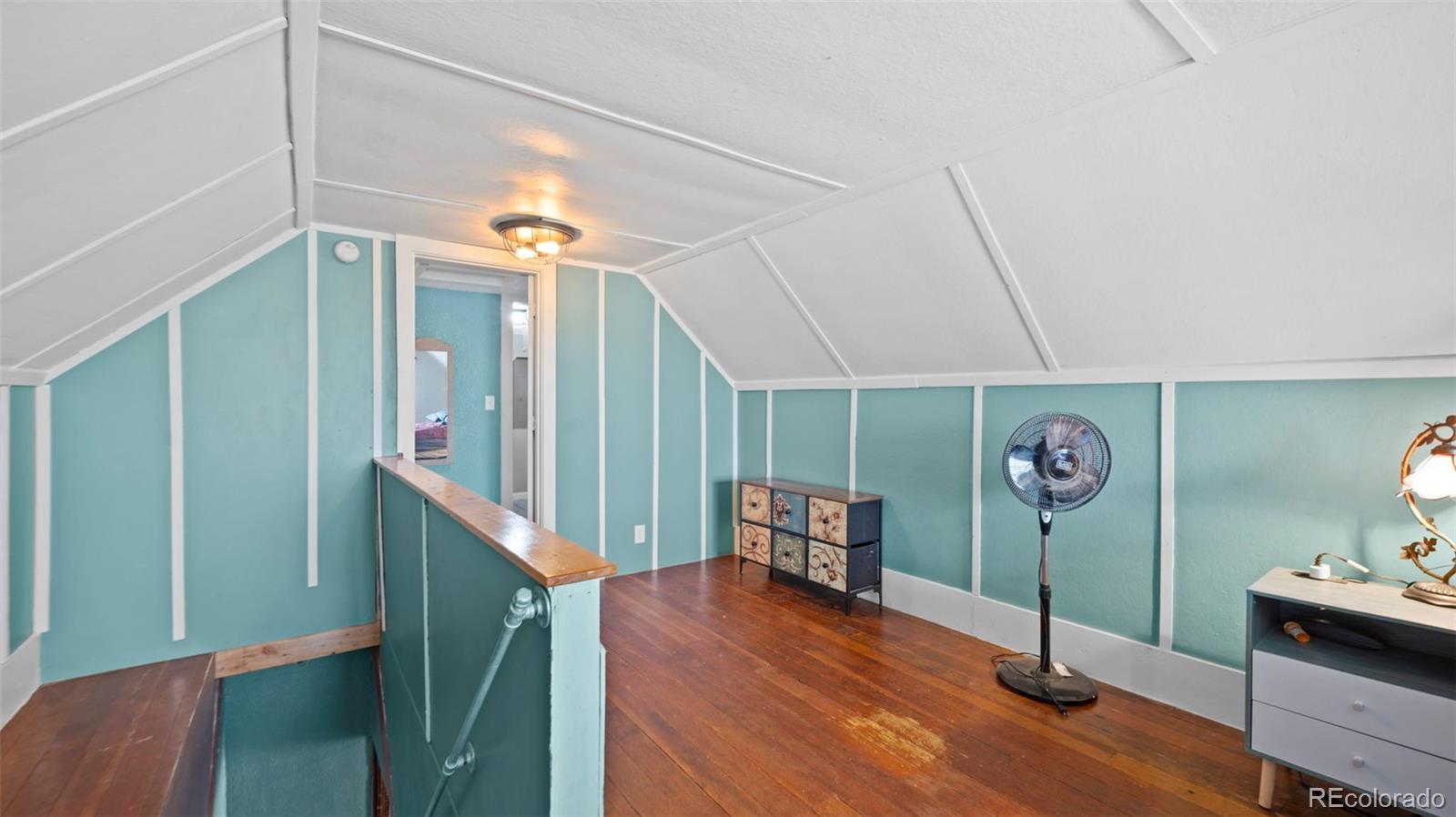 1935 County Road 75 Fleming, CO 80728 - Photo 20 of 50 a view of a hardwood & staircase