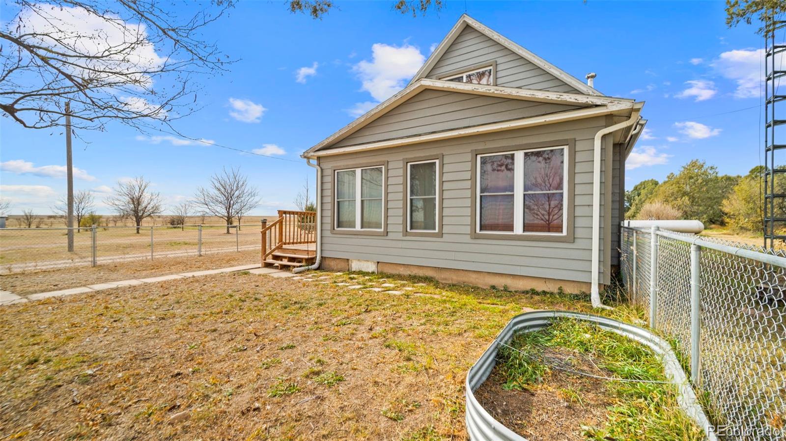 1935 County Road 75 Fleming, CO 80728 - Photo 2 of 50 a house view with a outdoor space