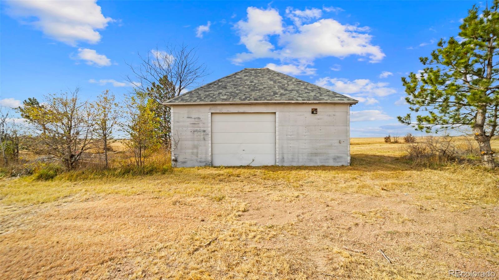 1935 County Road 75 Fleming, CO 80728 - Photo 29 of 50 a front view of a house with a yard