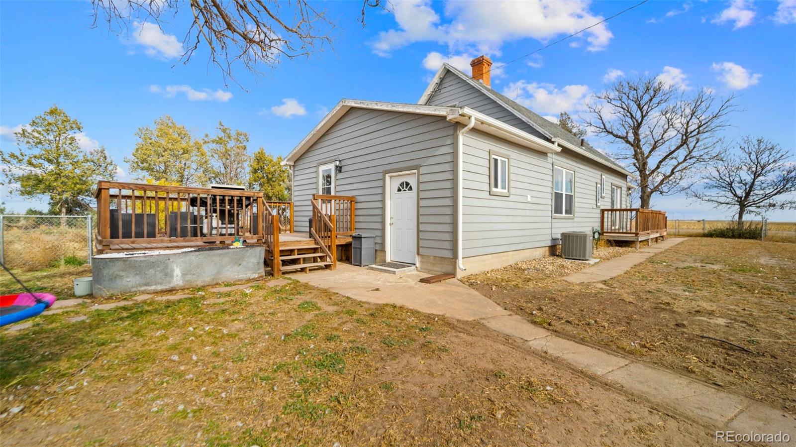 1935 County Road 75 Fleming, CO 80728 - Photo 3 of 50 a view of a house with a outdoor space