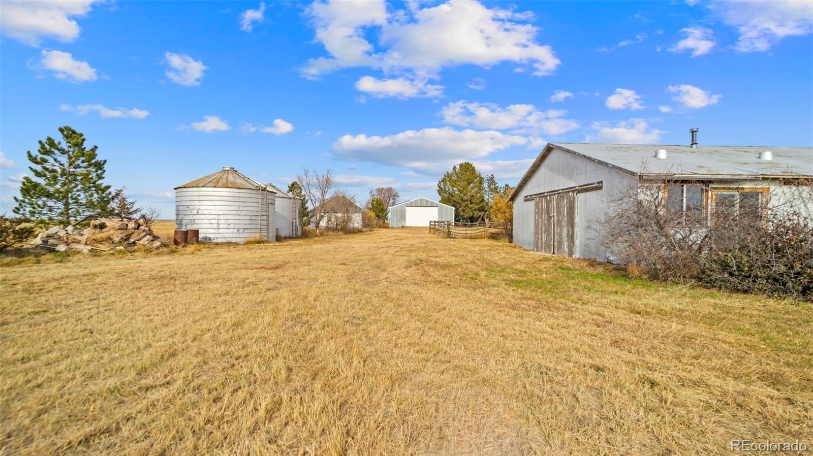 1935 County Road 75 Fleming, CO 80728 - Photo 34 of 50 a view of a house with a yard