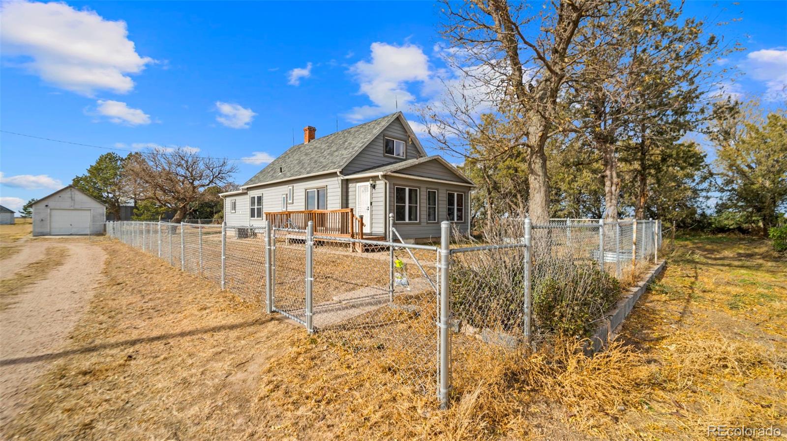 1935 County Road 75 Fleming, CO 80728 - Photo 35 of 50 a house with trees in front of it