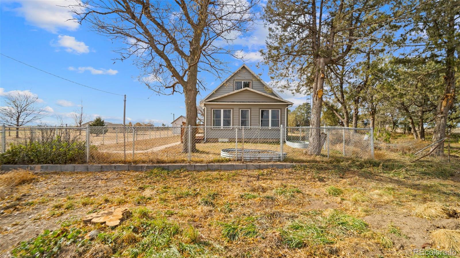 1935 County Road 75 Fleming, CO 80728 - Photo 36 of 50 a front view of a house with a yard