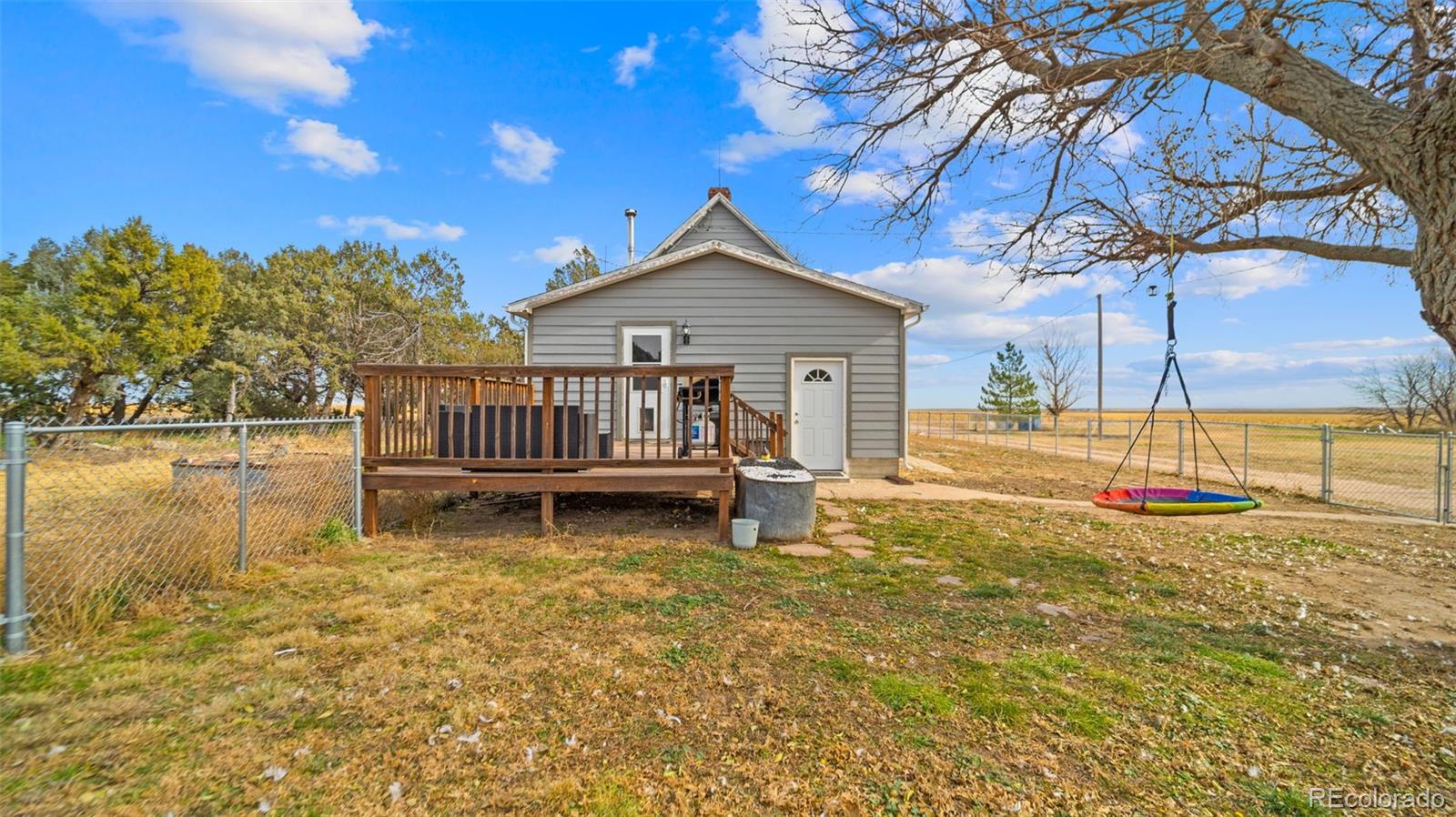 1935 County Road 75 Fleming, CO 80728 - Photo 4 of 50 a view of a house with backyard and sitting area