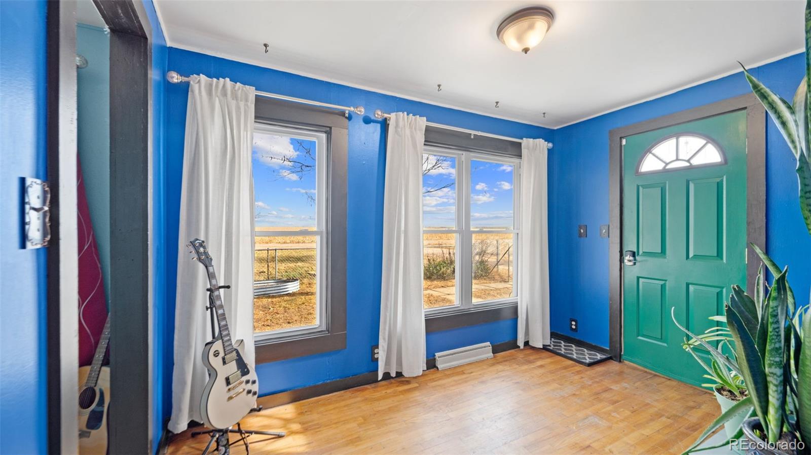 1935 County Road 75 Fleming, CO 80728 - Photo 7 of 50 a bedroom with a bed and a window