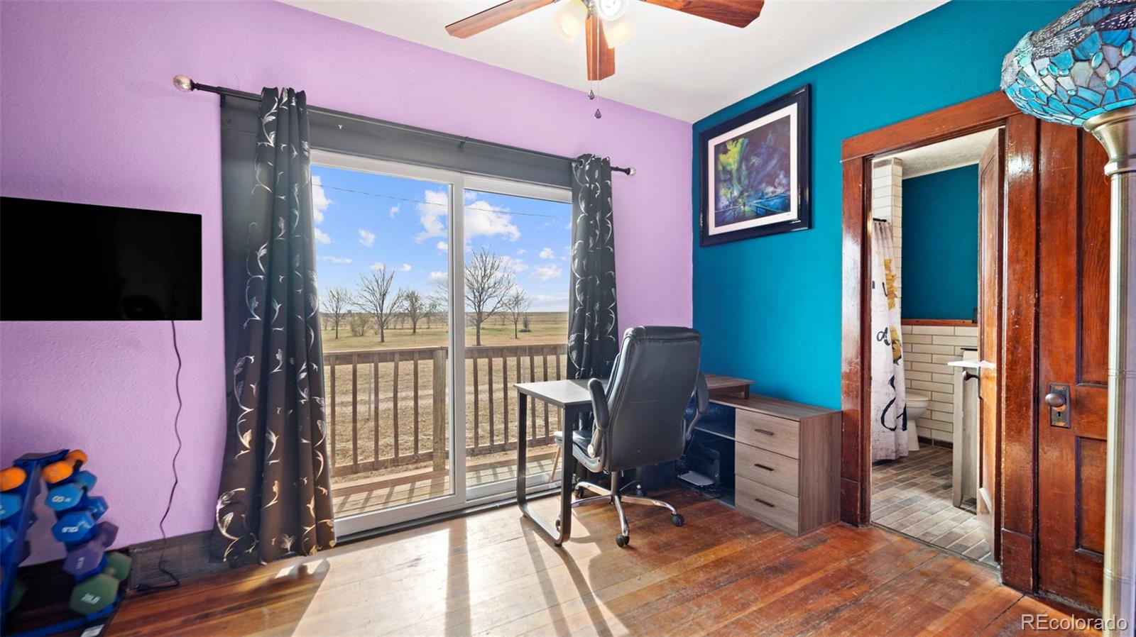 1935 County Road 75 Fleming, CO 80728 - Photo 9 of 50 a view of a workspace with furniture and a window