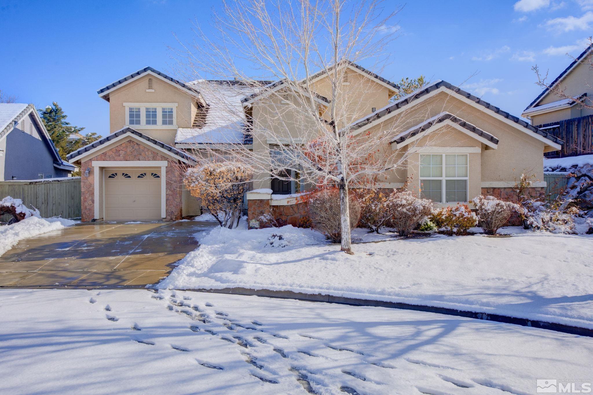 10692 Copper Moon Court Reno, NV 89521 - Photo 1 of 40 a front view of a house with garden