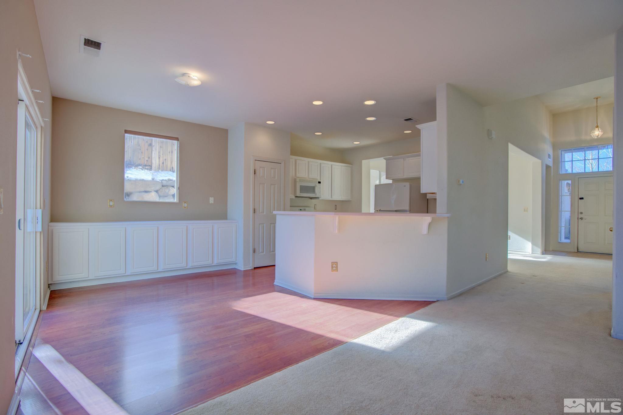 10692 Copper Moon Court Reno, NV 89521 - Photo 15 of 40 a view of kitchen and hall with wooden floor