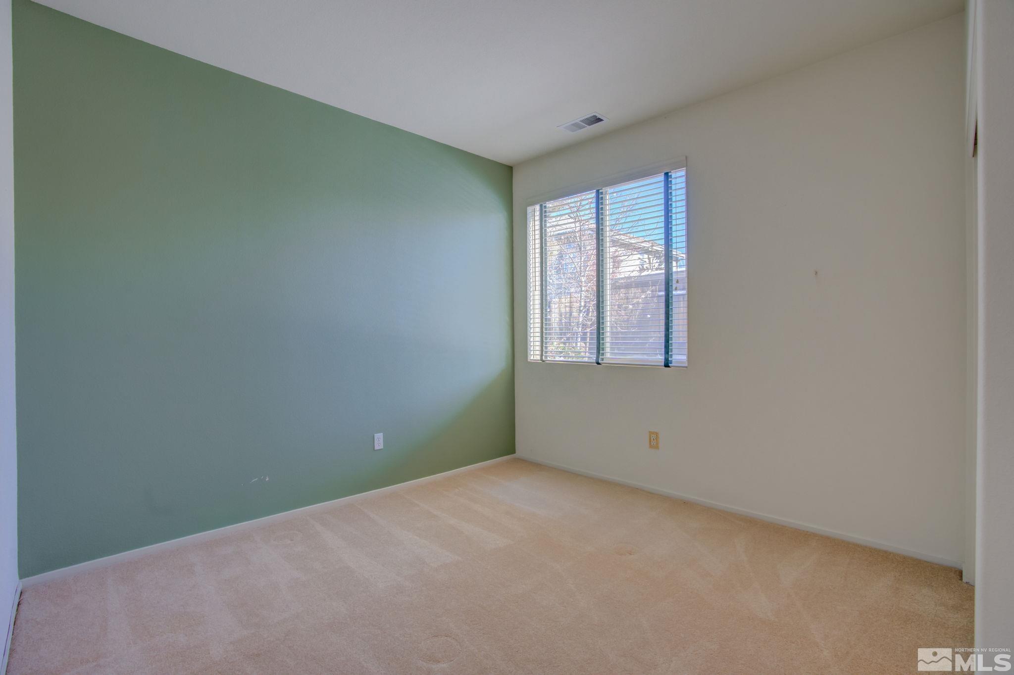 10692 Copper Moon Court Reno, NV 89521 - Photo 17 of 40 a view of an empty room with a window