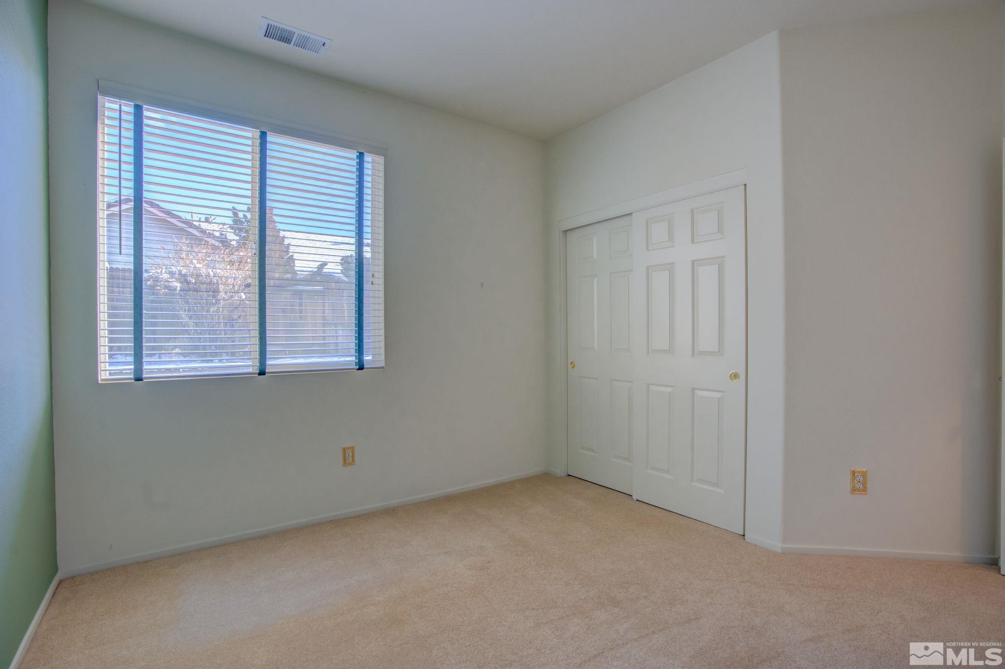 10692 Copper Moon Court Reno, NV 89521 - Photo 19 of 40 an empty room with windows