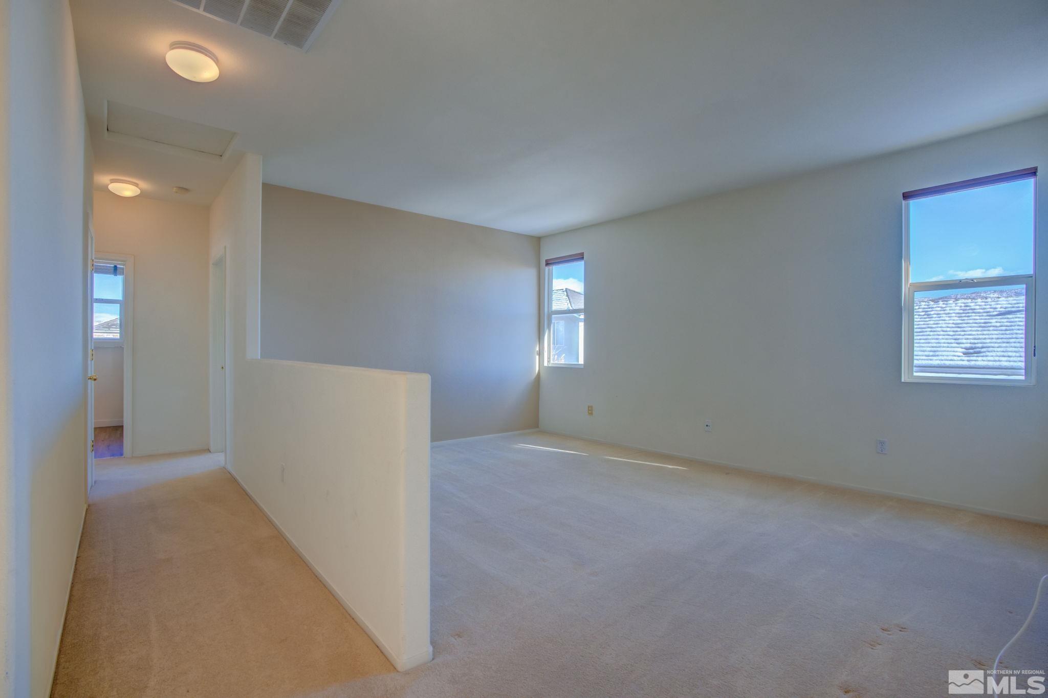10692 Copper Moon Court Reno, NV 89521 - Photo 21 of 40 an empty room with windows and closet