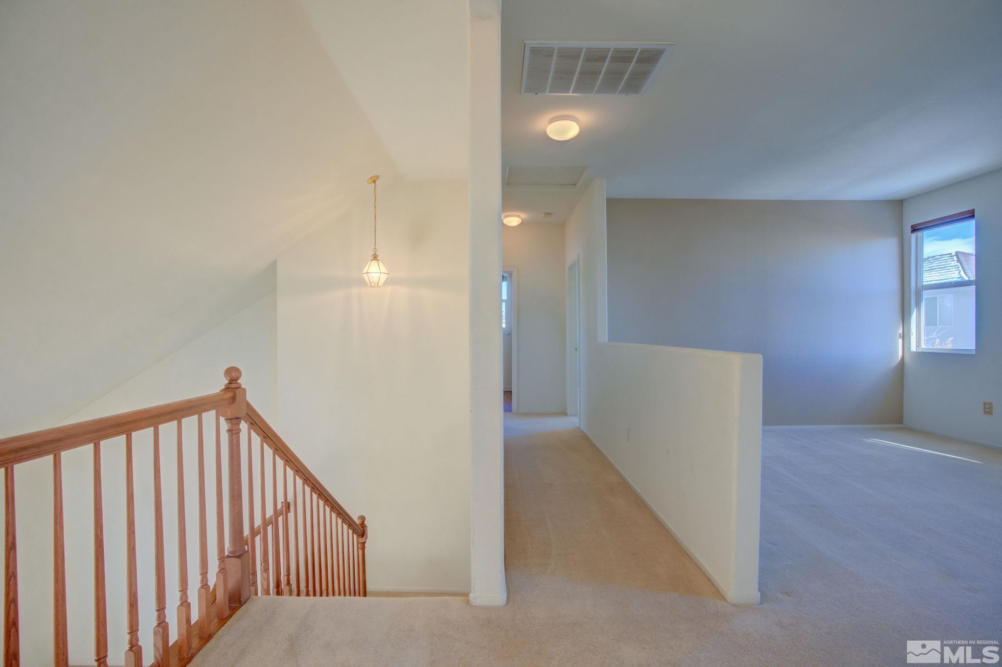 10692 Copper Moon Court Reno, NV 89521 - Photo 22 of 40 a view of a livingroom with a staircase