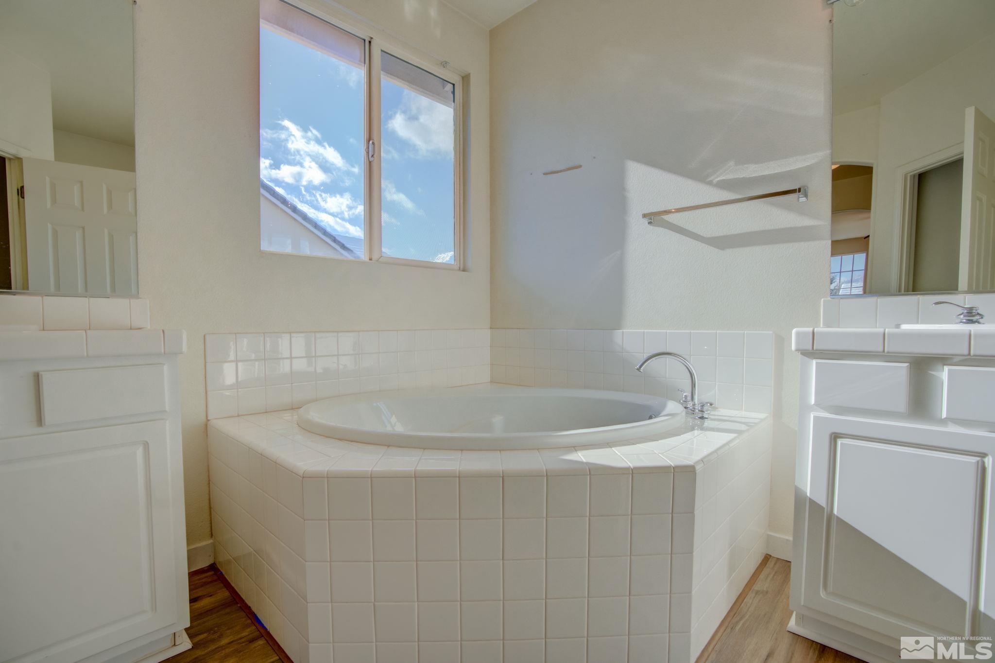 10692 Copper Moon Court Reno, NV 89521 - Photo 30 of 40 a bathroom with a sink and a mirror