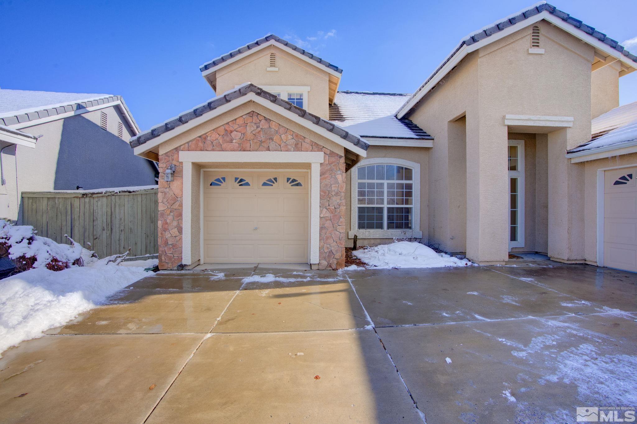 10692 Copper Moon Court Reno, NV 89521 - Photo 3 of 40 a view of a house with a yard