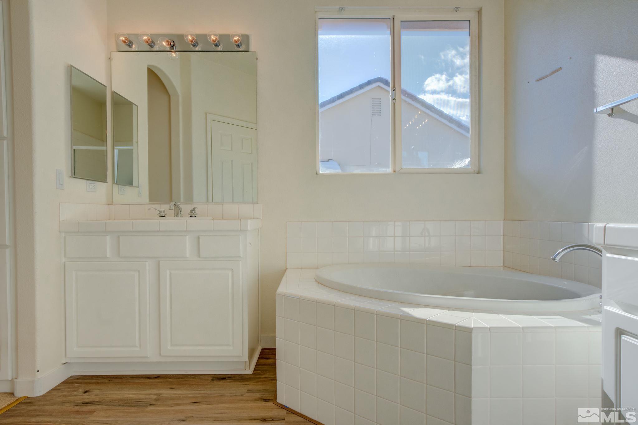 10692 Copper Moon Court Reno, NV 89521 - Photo 31 of 40 a bathroom with a sink and vanity