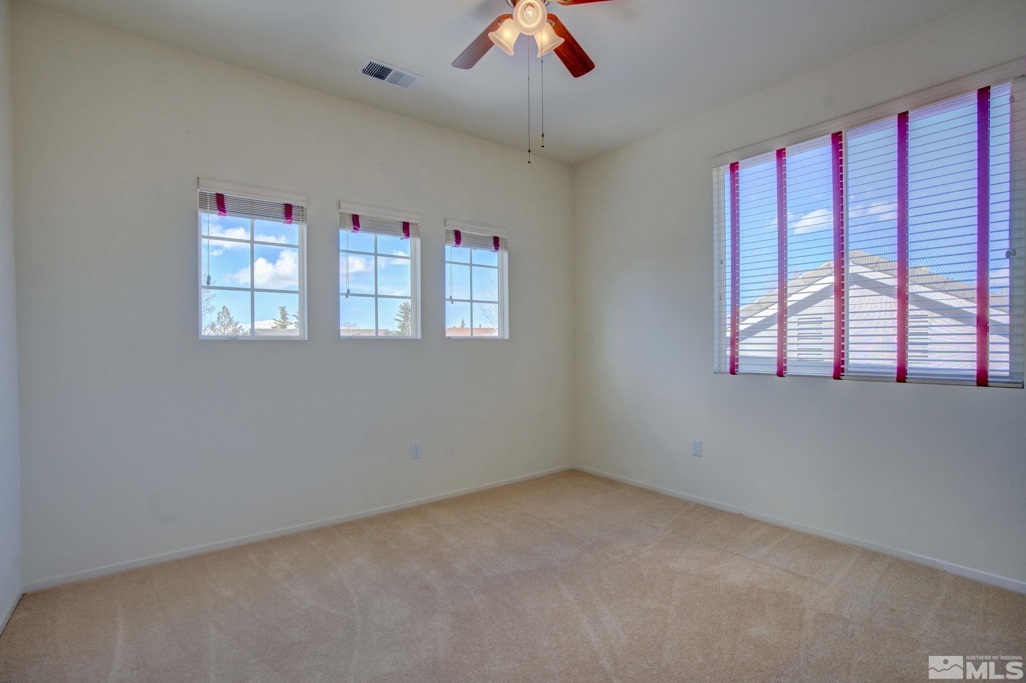 10692 Copper Moon Court Reno, NV 89521 - Photo 36 of 40 a view of an empty room with a window
