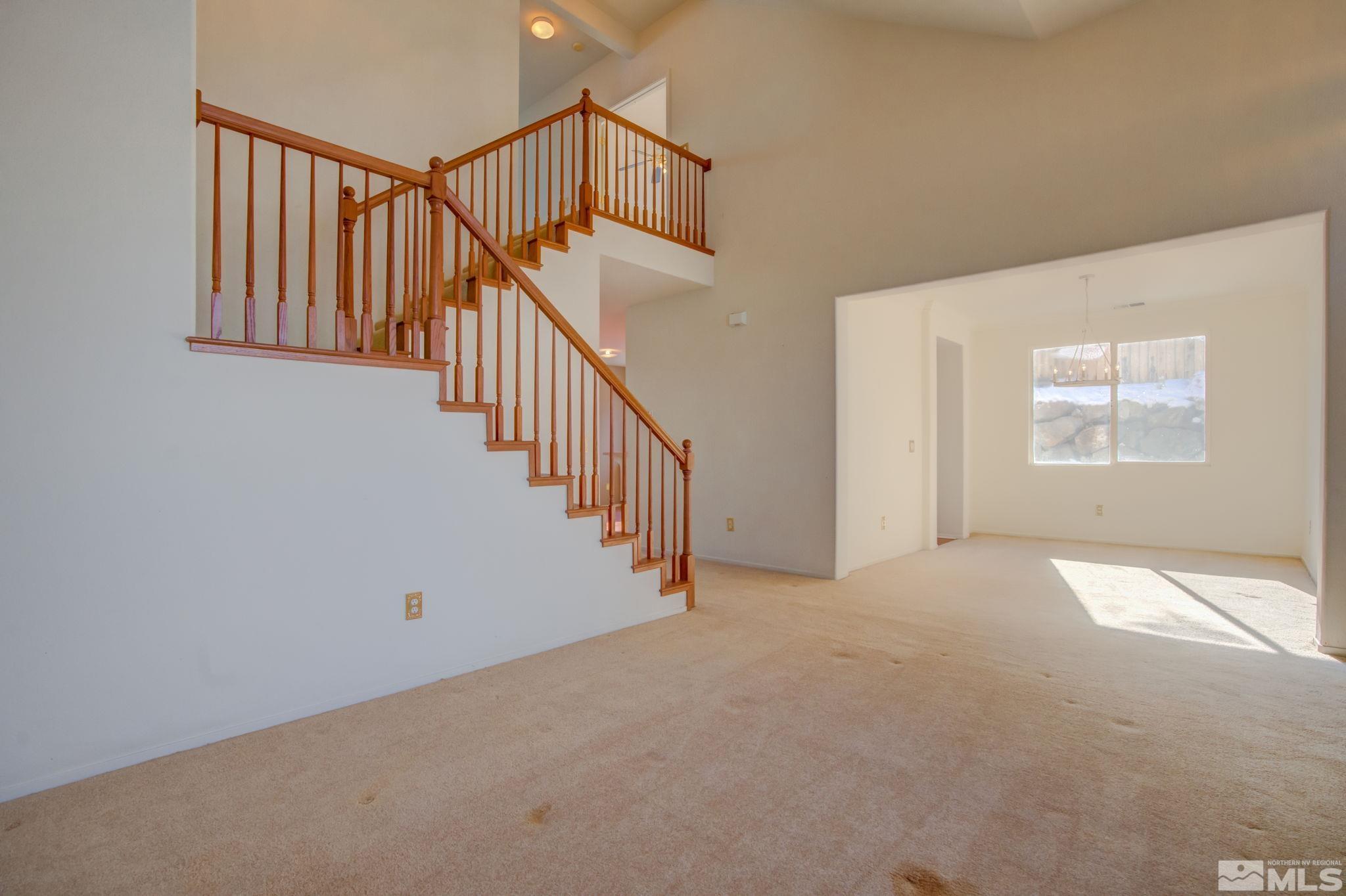 10692 Copper Moon Court Reno, NV 89521 - Photo 6 of 40 a view of an empty room with stairs