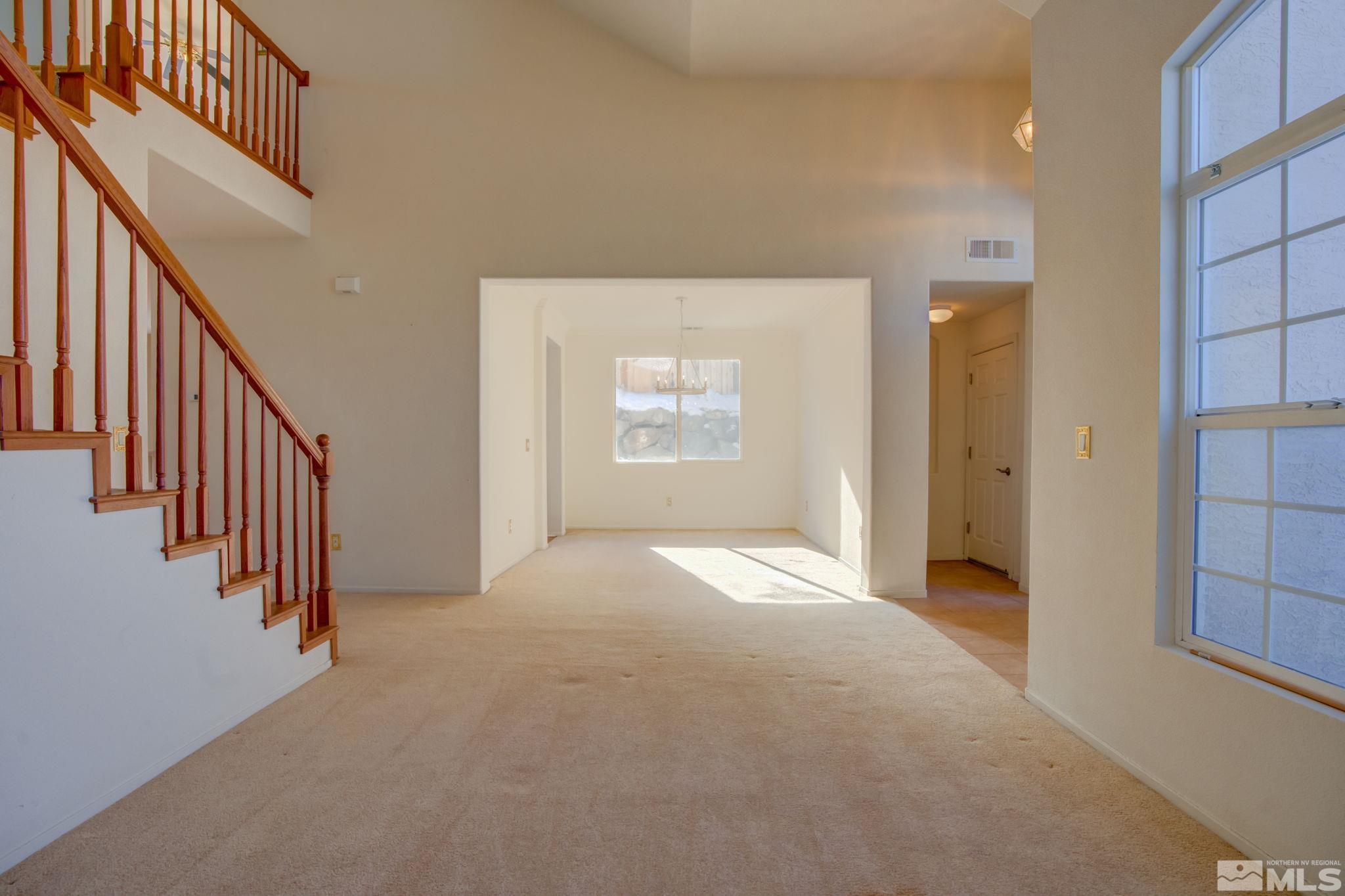10692 Copper Moon Court Reno, NV 89521 - Photo 7 of 40 a view of an empty room with a window