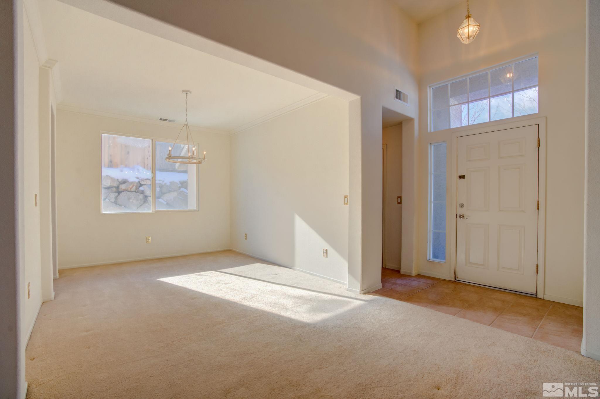 10692 Copper Moon Court Reno, NV 89521 - Photo 8 of 40 an empty room with windows