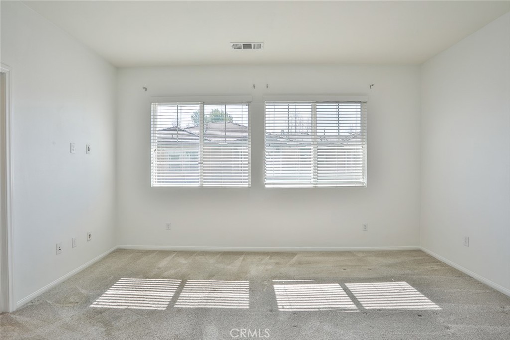 7863 Marbil Lane Riverside, CA 92504 - Photo 12 of 30 an empty room with a window