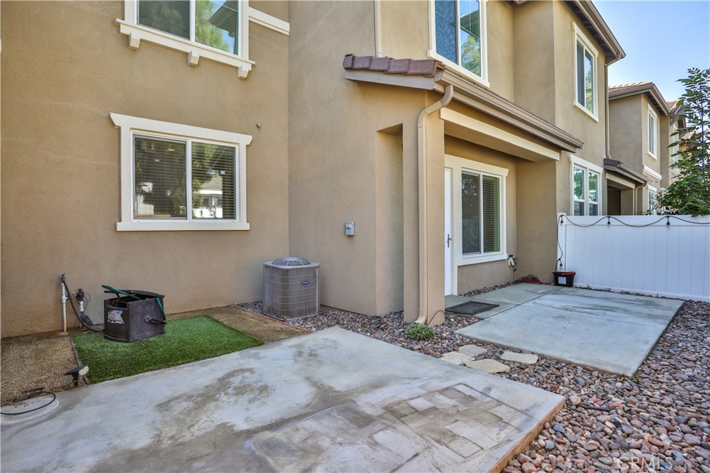 7863 Marbil Lane Riverside, CA 92504 - Photo 27 of 30 a front view of a house with garden