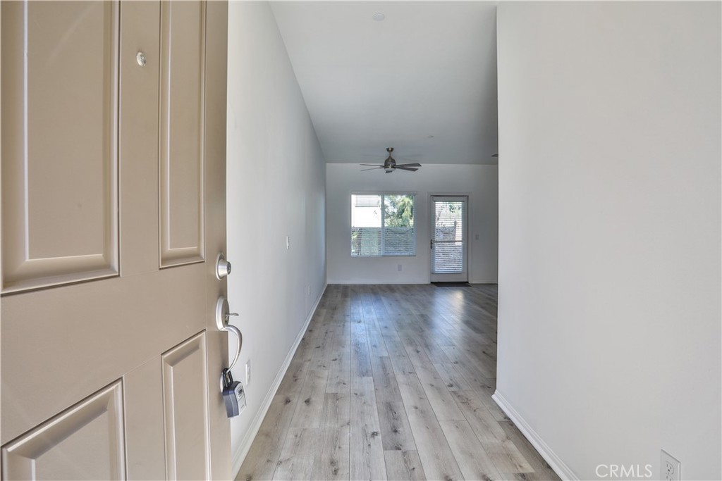7863 Marbil Lane Riverside, CA 92504 - Photo 4 of 30 a view of wooden floor and windows in a room