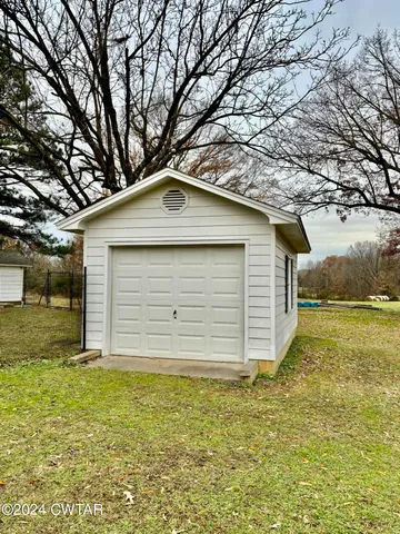 a house with trees in the background