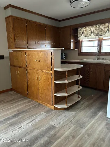 a view of kitchen with furniture and window