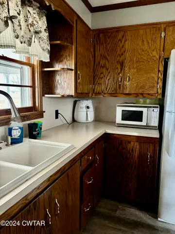 a kitchen with a sink and cabinets
