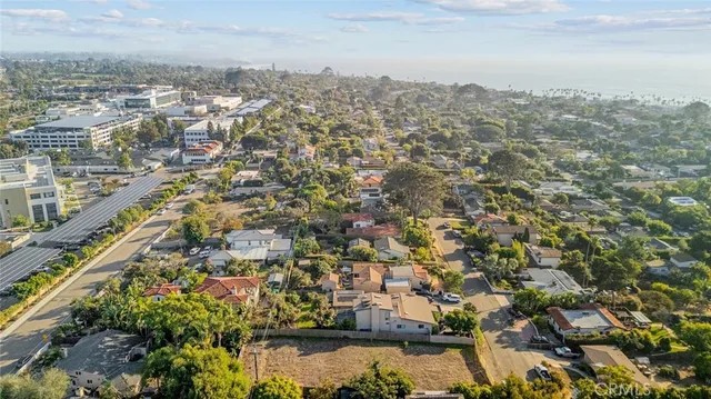 an aerial view of residential building with trees