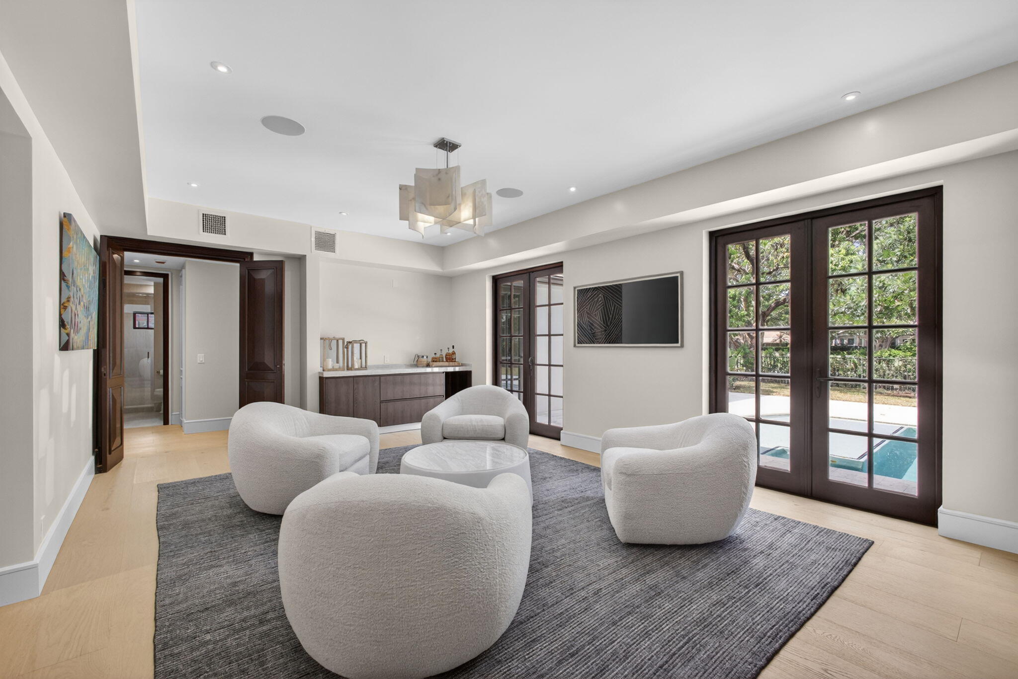17 Carrick Road Palm Beach Gardens, FL 33418 - Photo 17 of 53 a living room with furniture wooden floor and a large window