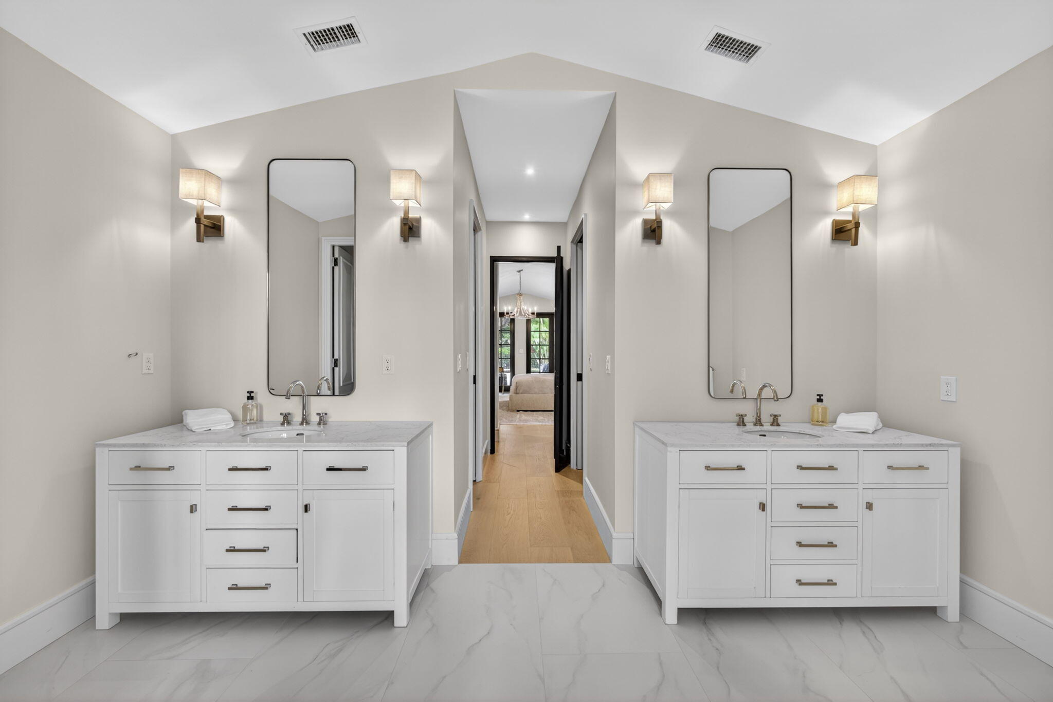 17 Carrick Road Palm Beach Gardens, FL 33418 - Photo 23 of 53 walk in bathroom with a double vanity sink and mirror